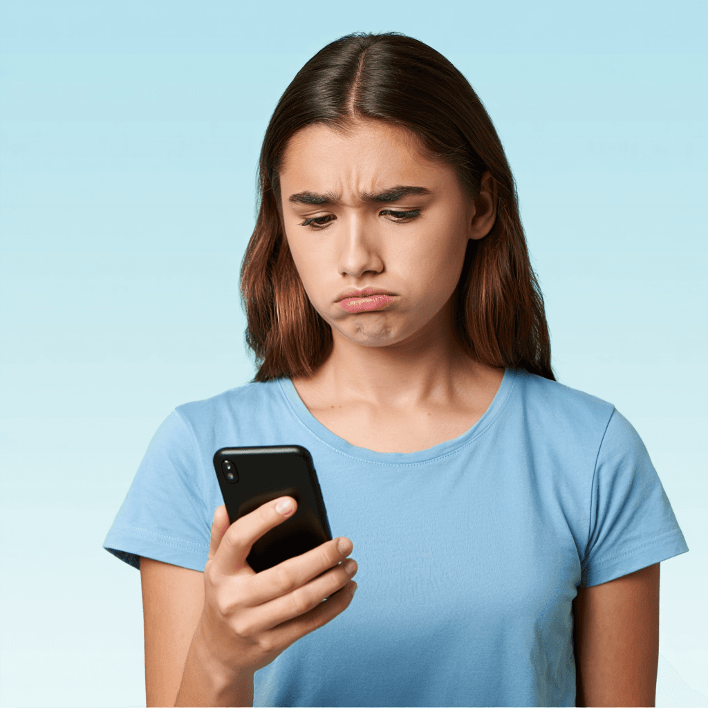 Teen looking concerned at phone